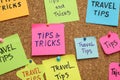 Colorful paper notes pinned to cork board, closeup. Travel tips and tricks Royalty Free Stock Photo