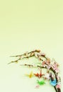 Colorful paper origami birds on flowering branches of cherry Royalty Free Stock Photo