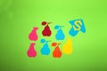 colorful paper pears on a green background with an up arrow, rising prices of pears, creative way Royalty Free Stock Photo