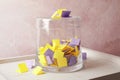 Colorful paper pieces for lottery and glass container