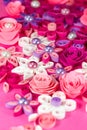 Colorful paper quilling flowers with pearls.