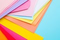 Colorful paper sheets on pastel background Royalty Free Stock Photo