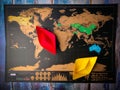 Colorful paper ships on the world map placed on a wooden table Royalty Free Stock Photo