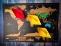 Colorful paper ships on the world map placed on a wooden table Royalty Free Stock Photo