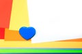 Colorful paper stack elegant background with blue heart and copy space Royalty Free Stock Photo