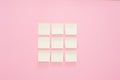 Colorful paper stickers on pink background. Top view. Flat lay. Copy space.Mock-up office stickers on a pink background