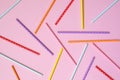 Colorful paper straws for drinking cocktails on a pink background. Ecology biodegradable product