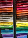 Colorful papers on shelves for sale