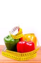 Colorful paprika and measuring tape, Diet concept
