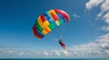 Colorful Paragliding Adventure Over Sparkling Blue Ocean Waters