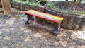 Colorful park wooden bench after rain