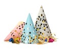 Colorful party hats, blowers and confetti streamers on white background Royalty Free Stock Photo