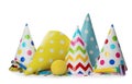 Colorful party hats and other festive items on white background Royalty Free Stock Photo