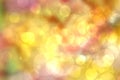 Colorful party invitation background. Abstract pastel yellow pink texture with blurred bokeh lights and soft color circles. Royalty Free Stock Photo