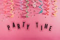 Colorful party streamers, gold little stars and text Party time