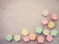 Colorful pastel artificial flower on recycled paper background, Royalty Free Stock Photo