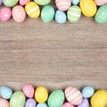 Easter egg double border on a square, light wood background