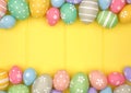 Colorful pastel Easter Egg double border against a yellow wood background