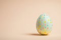 Colorful pastel easter egg with polka dot pattern for festive celebrations Royalty Free Stock Photo