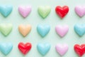 Colorful pastel plastic hearts pattern on pastel background