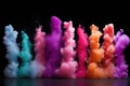 colorful pastel smoke bombs in a row against a black background