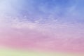 Colorful pastel sunrise or sunset sky with puffy fluffy soft clouds & white cloudscape Royalty Free Stock Photo