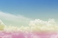 Colorful pastel sunrise or sunset sky with puffy fluffy white clouds Royalty Free Stock Photo