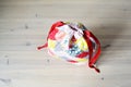 Colorful patchwork draw string bag on table Royalty Free Stock Photo