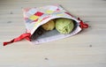 Colorful patchwork drawstring bag, green and yellow yarn, scissors Royalty Free Stock Photo