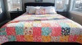 Colorful patchwork quilt on a bed Royalty Free Stock Photo