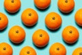 Colorful pattern of fresh mandarins orange fruits on background of cyan or aqua menthe of color.