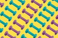 Colorful pattern made of blue and purple dumbbells