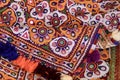 Colorful pattern and texture in cloth,Indian patchwork carpet in Rajasthan, Asia, Unidentified man embroidering cloth in