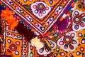 Colorful pattern and texture in cloth,Indian patchwork carpet in Rajasthan, Asia, Unidentified man embroidering cloth in Royalty Free Stock Photo