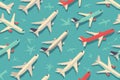 A colorful pattern of various airplane illustrations arranged in a seamless, repeating design on a light background Royalty Free Stock Photo