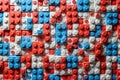 Colorful patterned surface of red, blue, and white interlocking plastic bricks Royalty Free Stock Photo