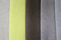 Colorful patterns of upholstery fabric. Close-up of samples of furniture fabric. Multicolored soft textile. Furniture industry.