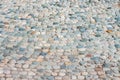 Colorful paved road with little different colors round stones