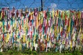 Colorful peace ribbons tied at a fence at the demilitarised zone DMZ at the freedom bridge, South Korea, Asia