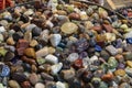 Colorful Pebble Stones, Rocks Wet On River Beach. Different Nature Smooth Pebble Stones As Natural Rock Abstract Pattern Texture