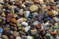Colorful Pebble Stones, Rocks Wet On River Beach. Different Nature Smooth Pebble Stones As Natural Rock Abstract Pattern Texture