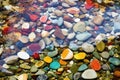 colorful pebbles beneath clear stream water