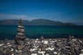 Colorful pebbles touching wave at beautiful rock island, called Koh Hin Ngam, near Lipe island, Thailand