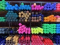 Colorful pen being arranged in a shelf for sale. Royalty Free Stock Photo