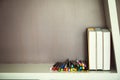 Colorful pen and books on shelve