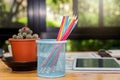 Colorful pencil in box with cactus pot on desk in office Royalty Free Stock Photo