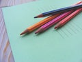 Colorful pencil colors and writing book for back to school Royalty Free Stock Photo