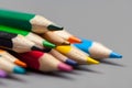 Colorful pencils arrangement on grey background close up Royalty Free Stock Photo