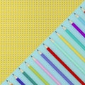 Colorful pencils on blue and yellow color point pattern contrast Royalty Free Stock Photo