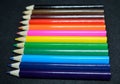 Colorful pencils collection on black background